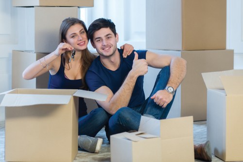 Removal team planning a home move in Chiswick with boxes and furniture
