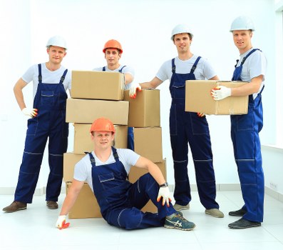 Removal team loading household items in Chiswick