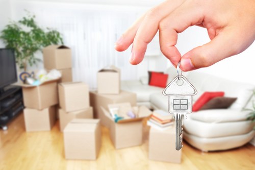 Professional movers handling boxes and furniture for a local move