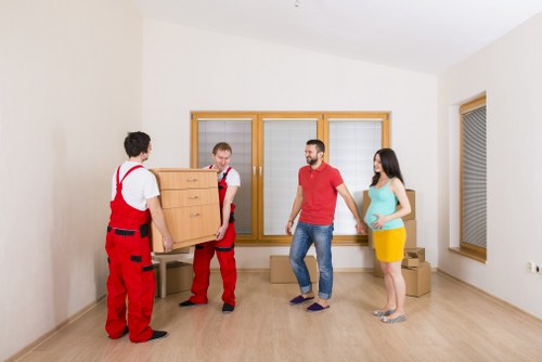 Worker using proper manual handling equipment