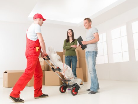 Office equipment being moved by a professional team
