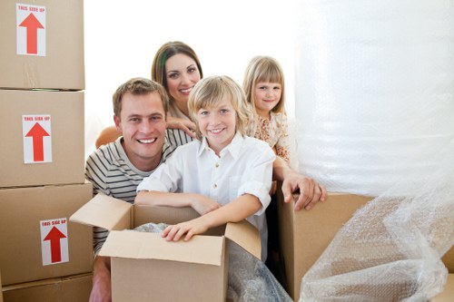Professional movers handling furniture and boxes during a Chiswick home relocation