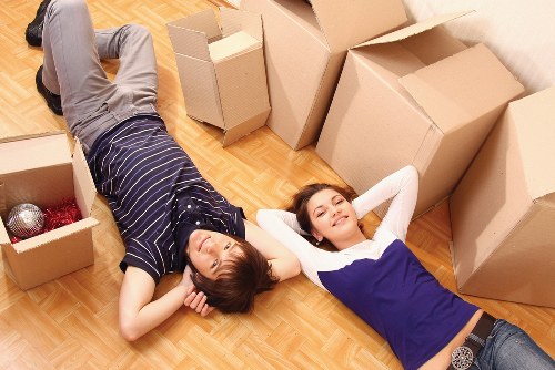 Helper unloading boxes at a Chiswick flat